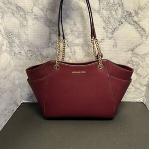 Michael Kors Burgundy and gold handbag